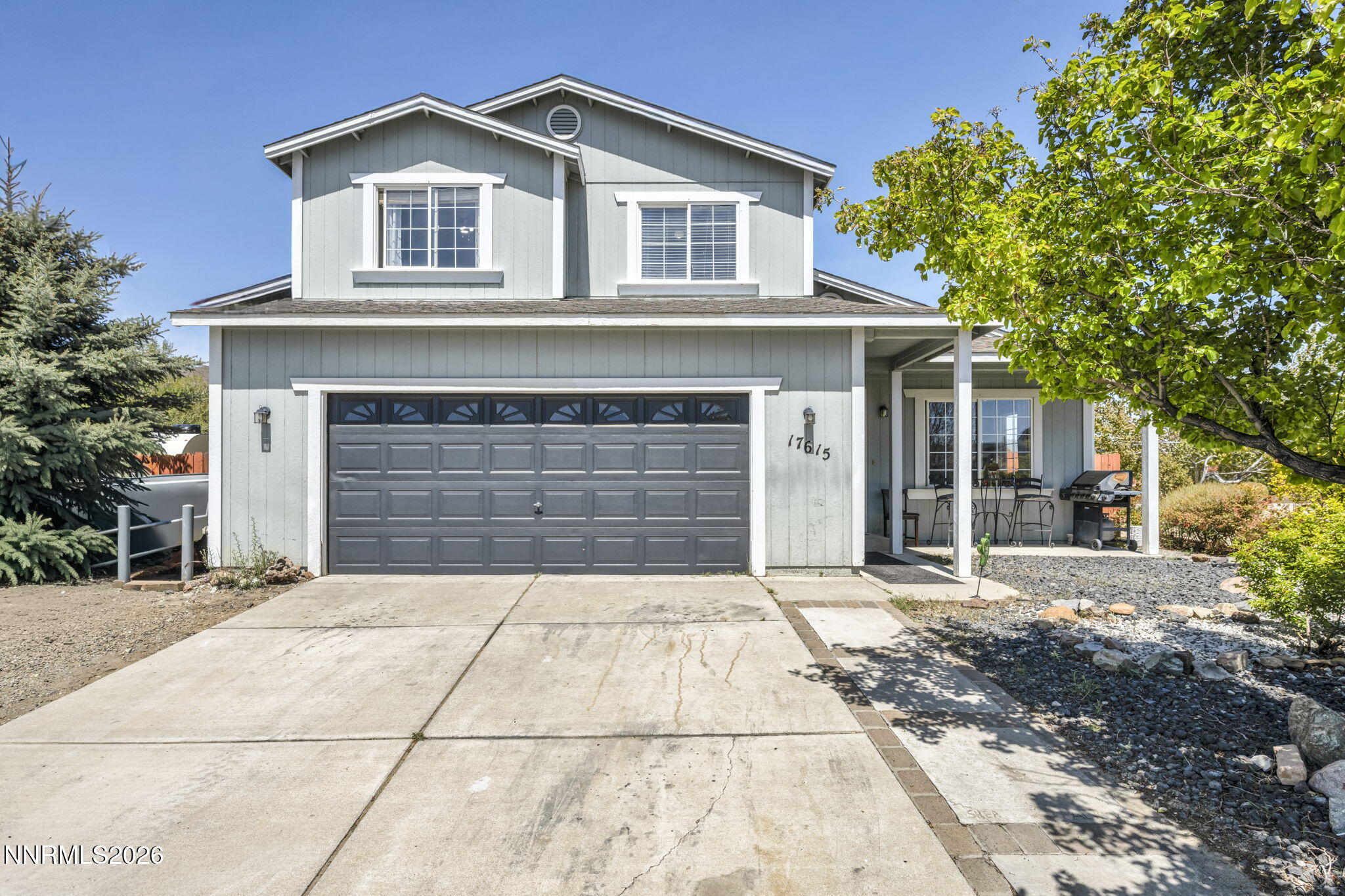 17615 Baileyville Court Reno, NV 89508 - Photo 1 of 19 a front view of a house with a yard and garage