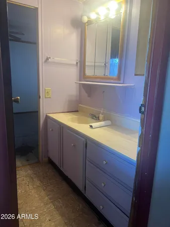 a utility room with cabinets washer and dryer