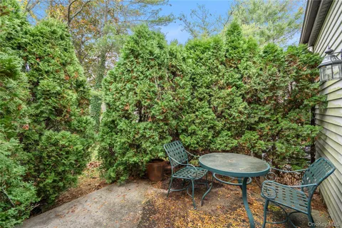 a backyard with table and chairs