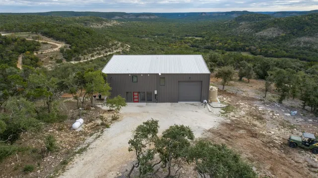 a view of a big yard with lots of green space and mountain view