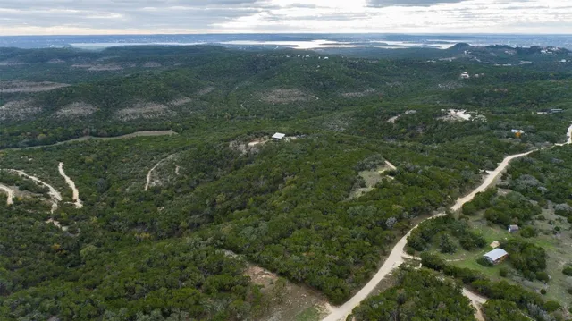 a view of a field with an ocean view