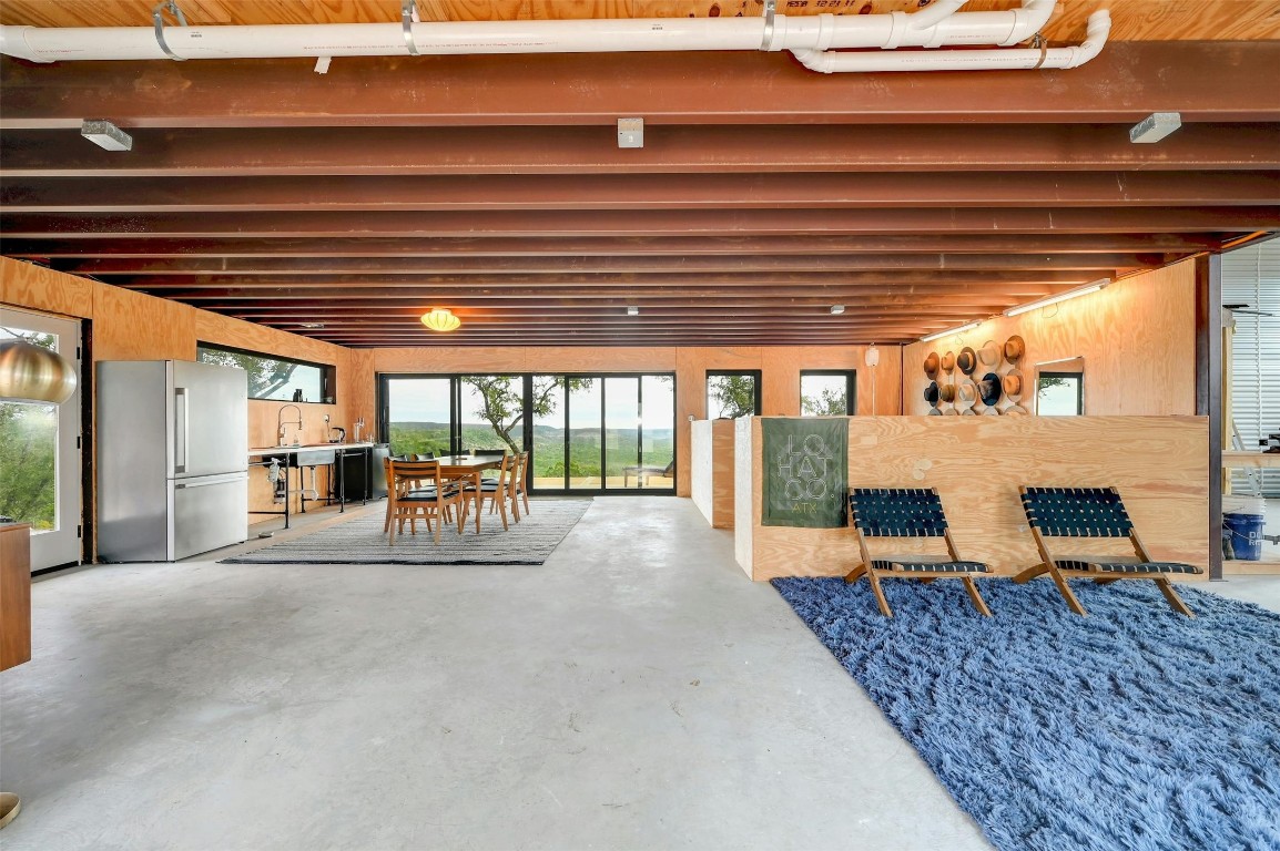 640 Ghost Dancer Fischer, TX 78623 - Photo 7 of 40 a view of a patio with table and chairs and couches with wooden floor