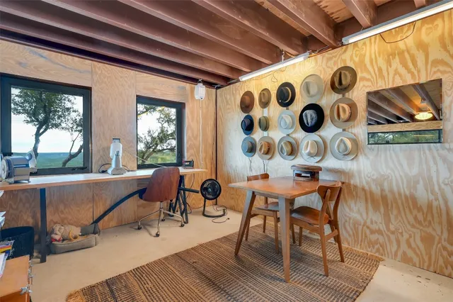 a living room with a rug and a table