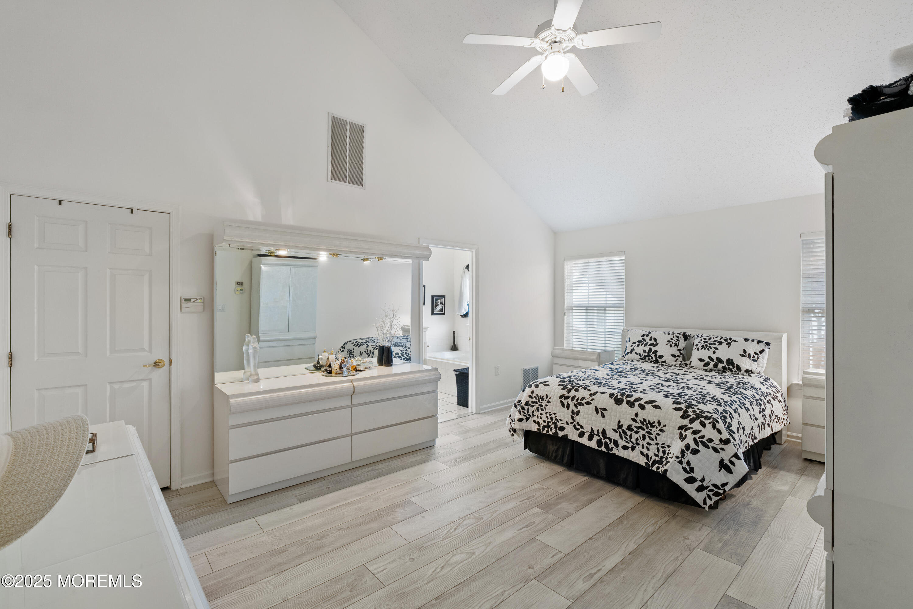 7 Regent Square Jackson, NJ 08527 - Photo 12 of 29 a living room with furniture and a large mirror