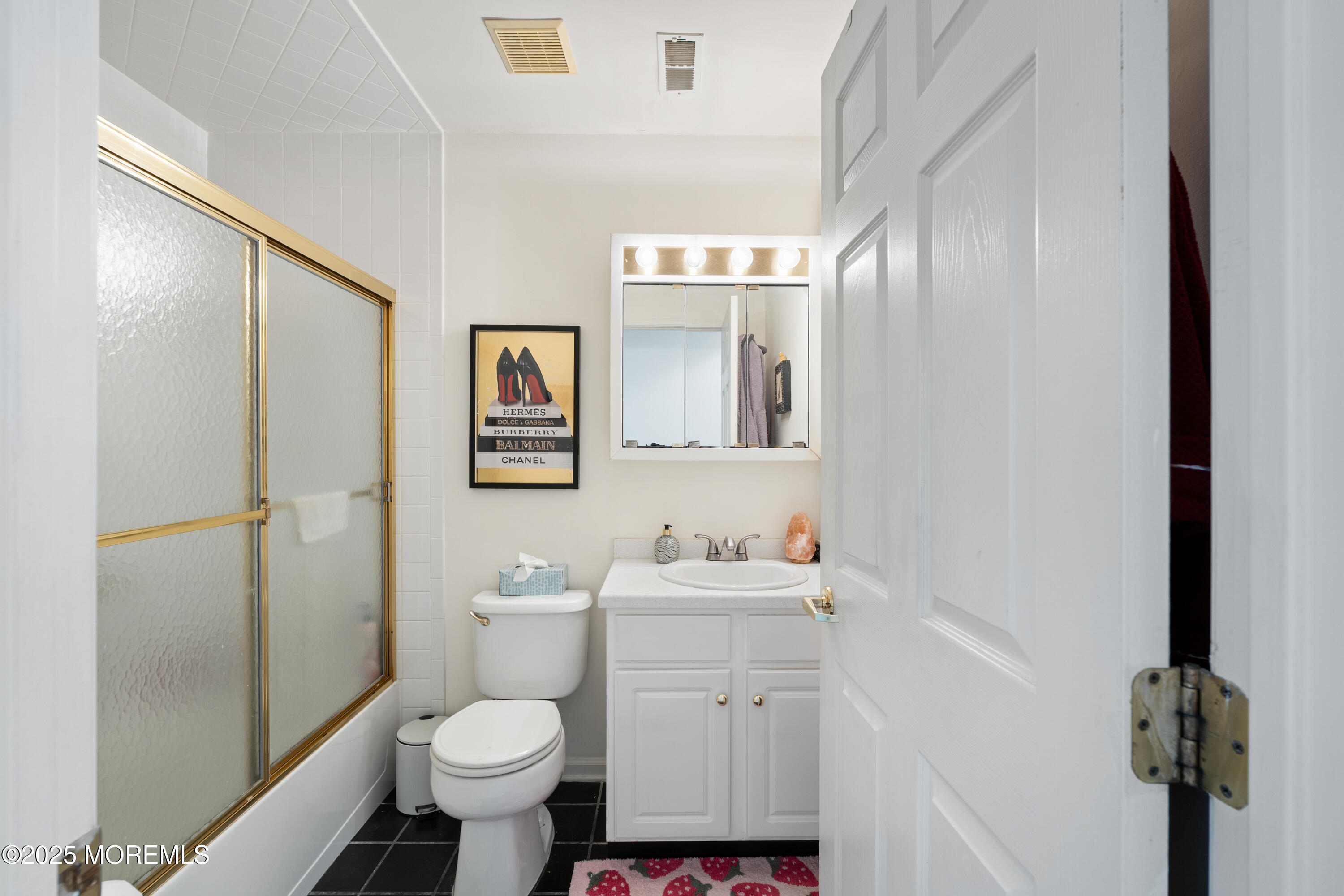 7 Regent Square Jackson, NJ 08527 - Photo 15 of 29 a bathroom with a sink toilet and a mirror