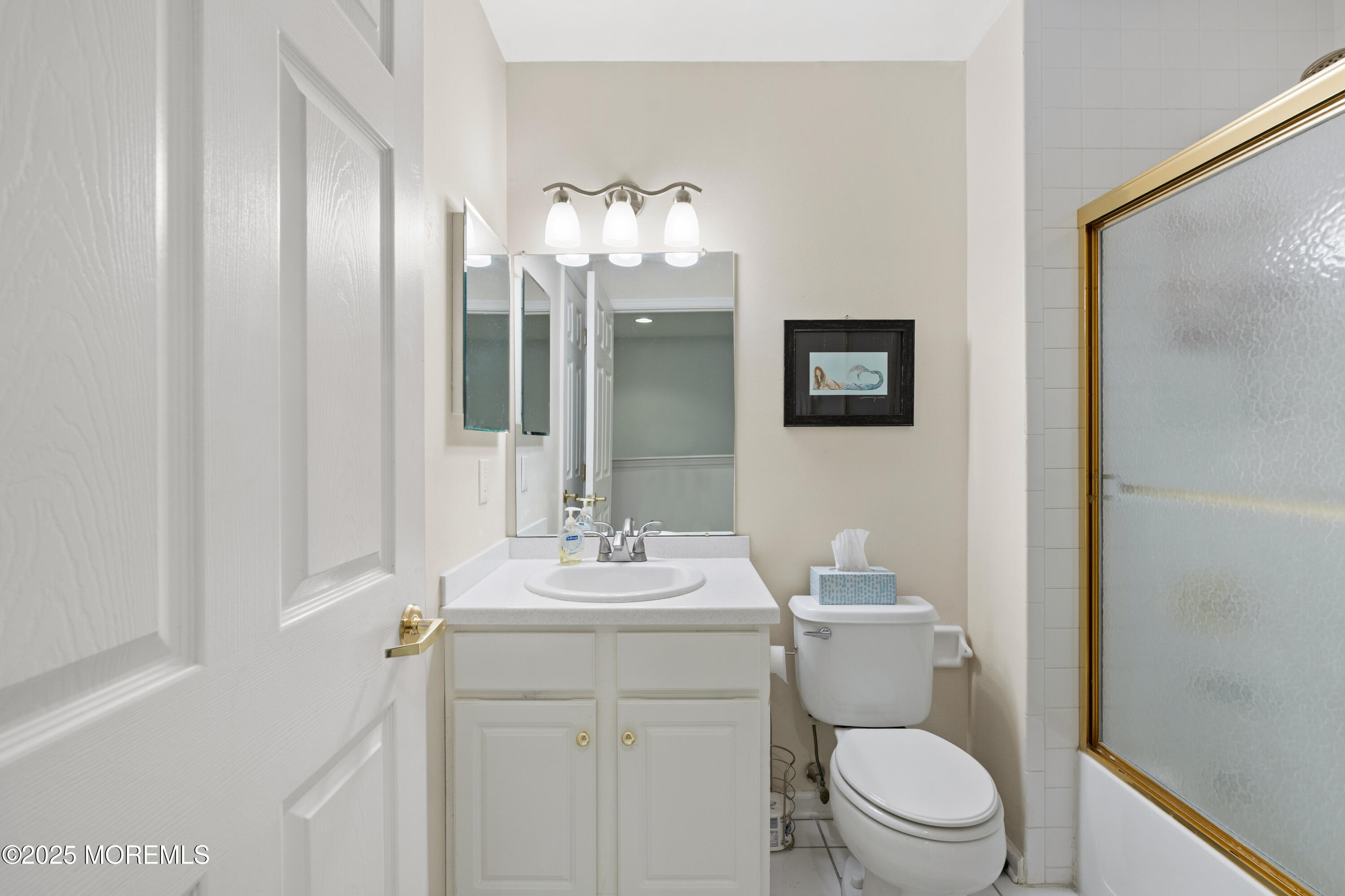 7 Regent Square Jackson, NJ 08527 - Photo 17 of 29 a bathroom with a toilet a sink and mirror