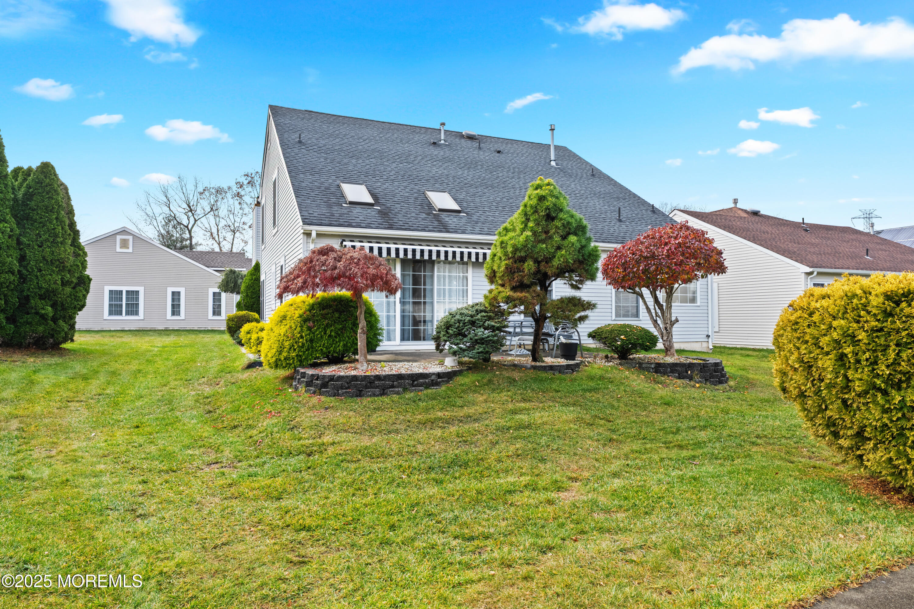 7 Regent Square Jackson, NJ 08527 - Photo 22 of 29 a front view of house with yard and outdoor seating