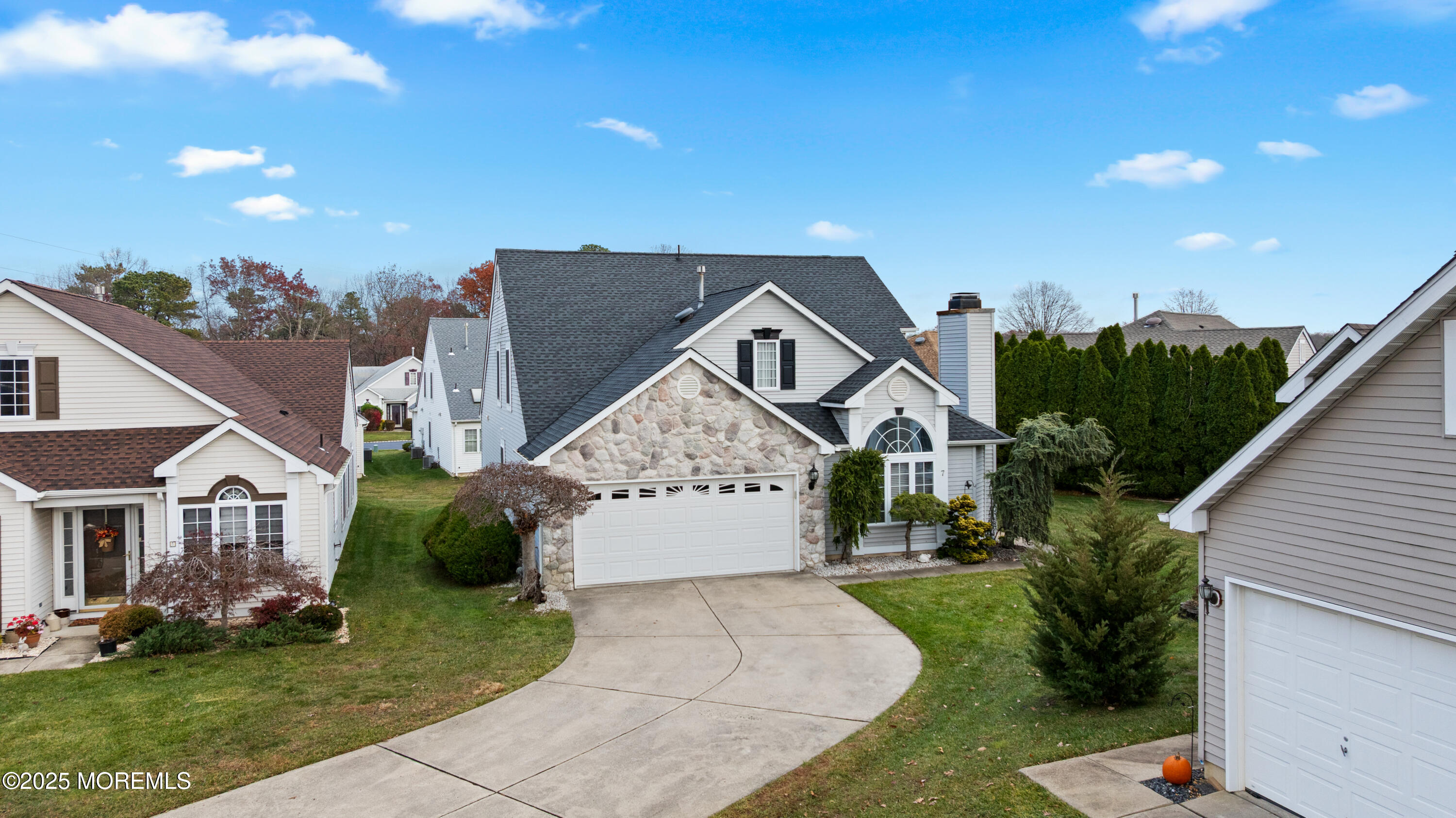 7 Regent Square Jackson, NJ 08527 - Photo 24 of 29 a front view of a house with a yard and garage