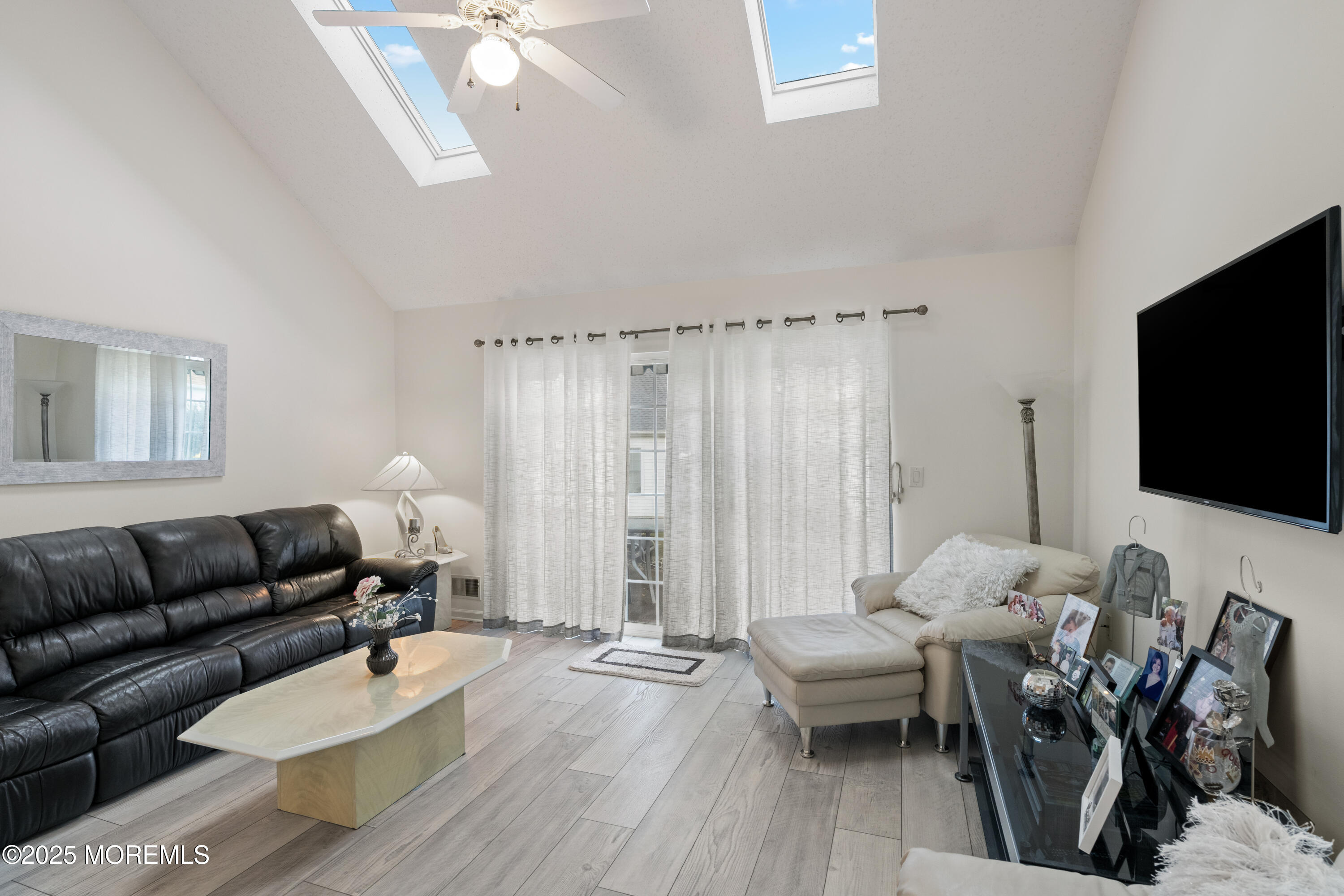 7 Regent Square Jackson, NJ 08527 - Photo 9 of 29 a living room with furniture and a flat screen tv
