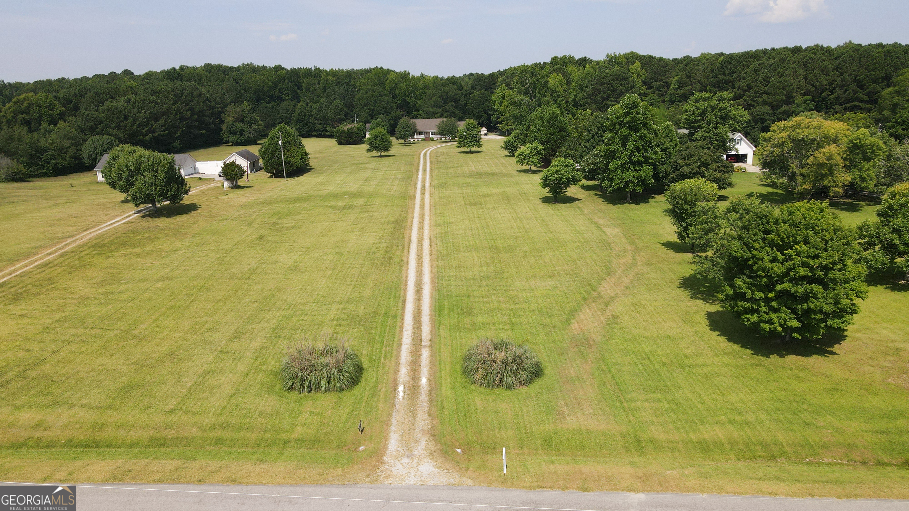 1881 Beeks Road Williamson, GA 30292 - Photo 2 of 32 a view of a lake with a mountain
