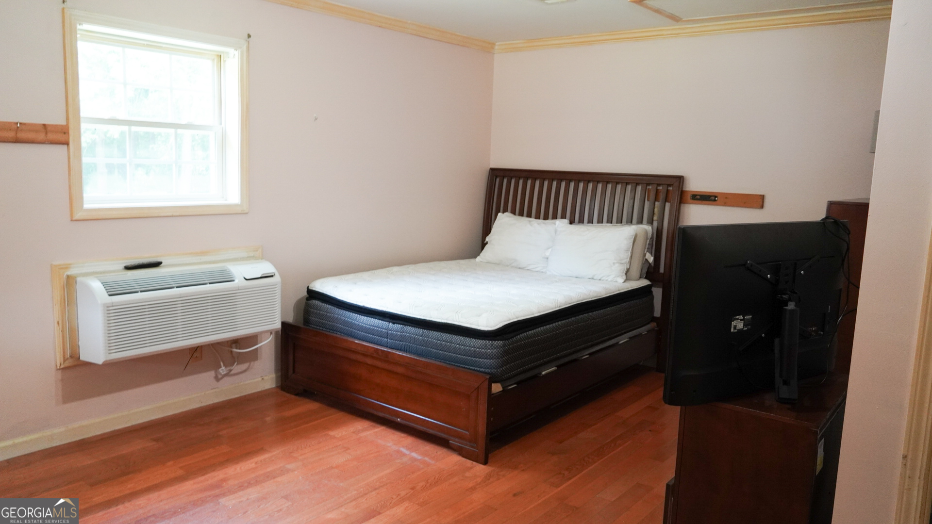 1881 Beeks Road Williamson, GA 30292 - Photo 24 of 32 a bedroom with a bed and a window
