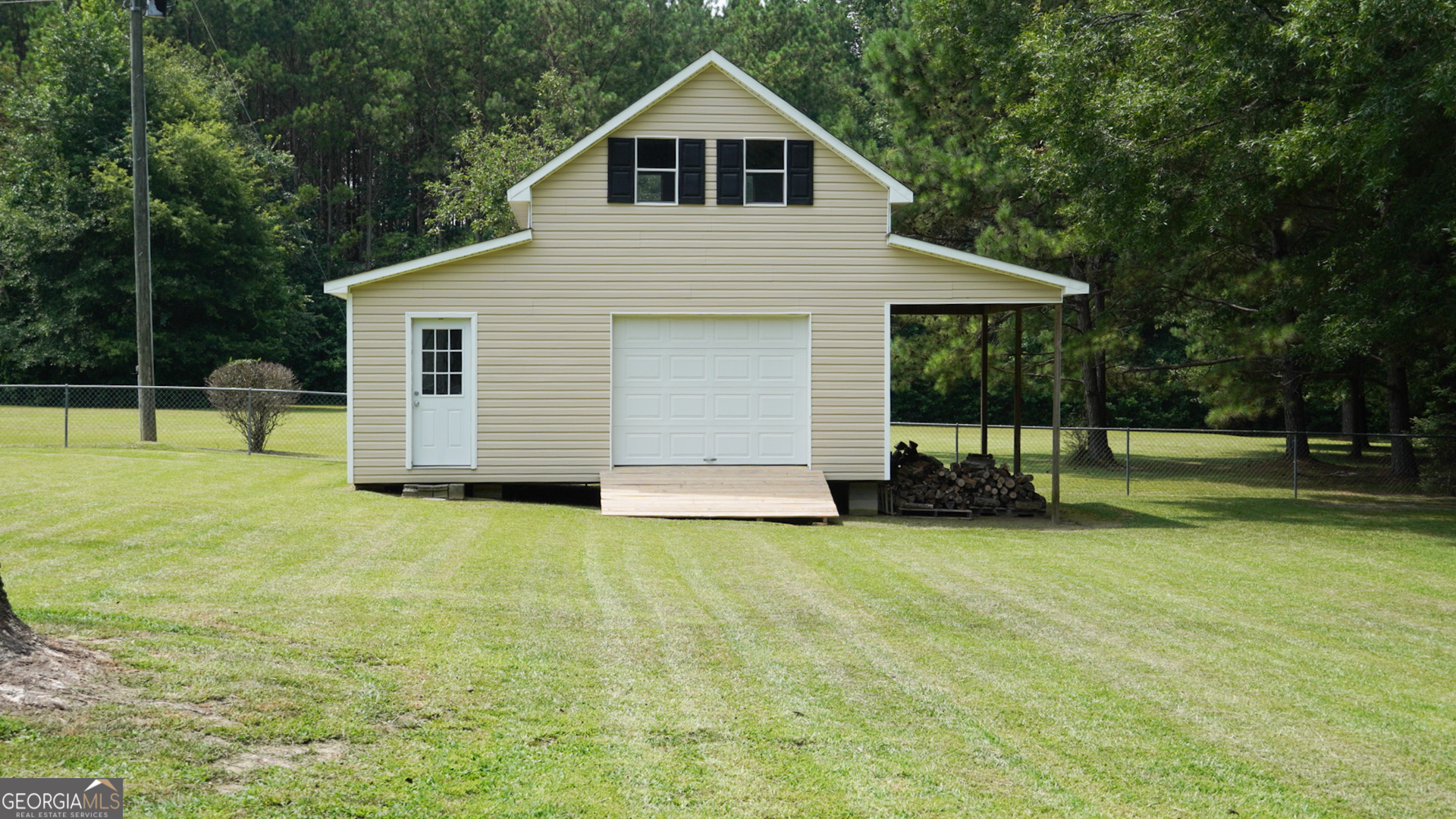 1881 Beeks Road Williamson, GA 30292 - Photo 27 of 32 a view of a house with backyard and trees