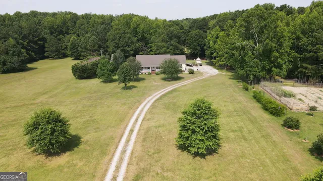 a view of a swimming pool with a yard