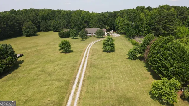 a view of a swimming pool with a yard