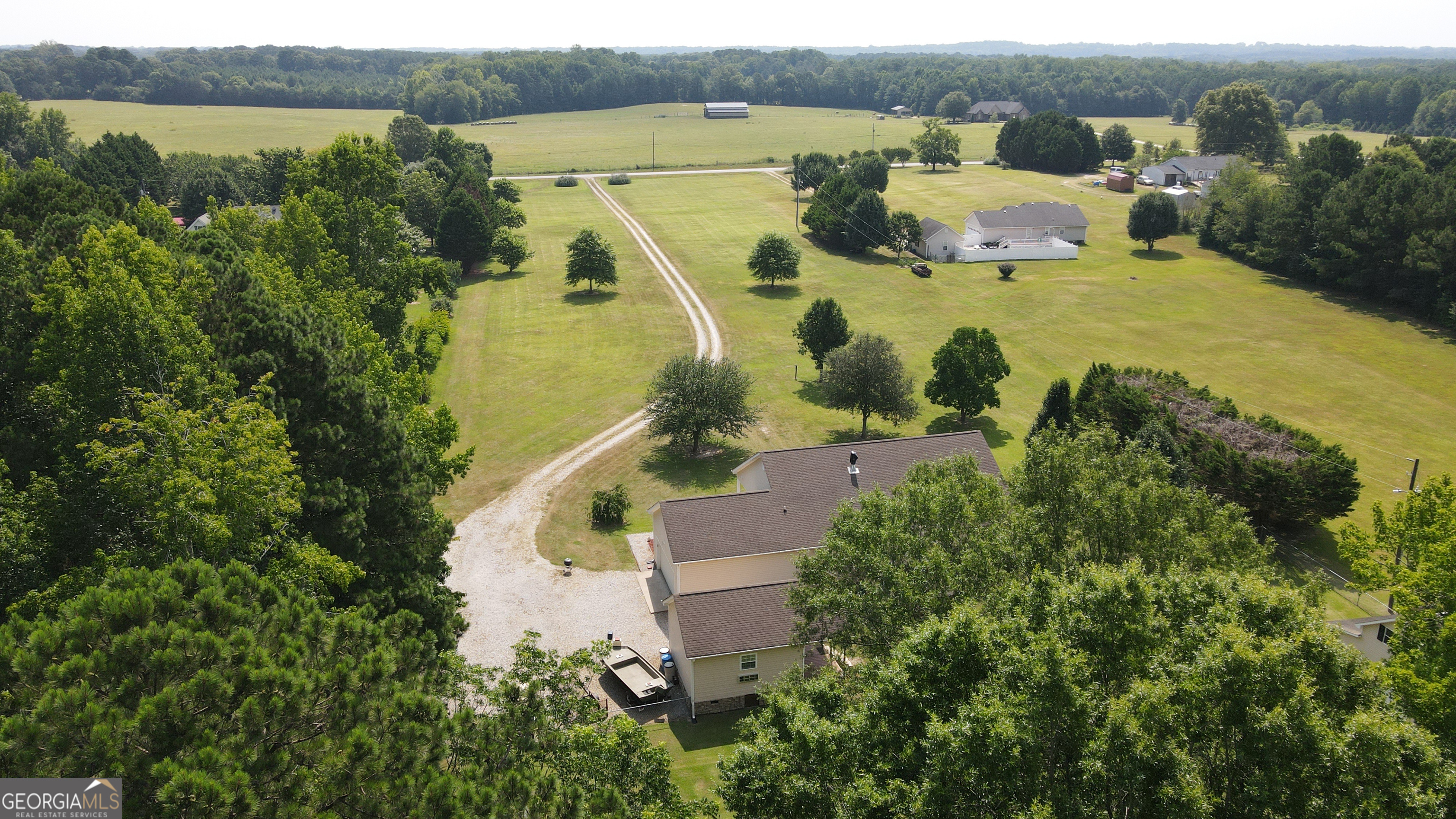 1881 Beeks Road Williamson, GA 30292 - Photo 32 of 32 an aerial view of a house with outdoor space and lake view