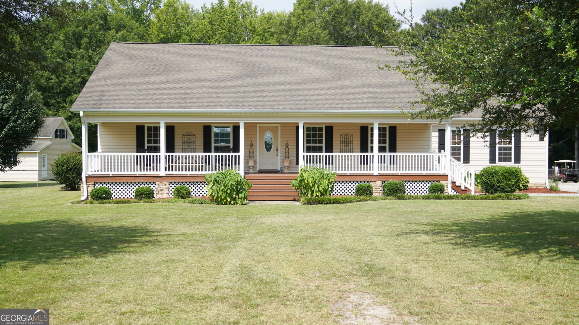1881 Beeks Road Williamson, GA 30292 - Photo 7 of 32 a front view of a house with a yard and green space