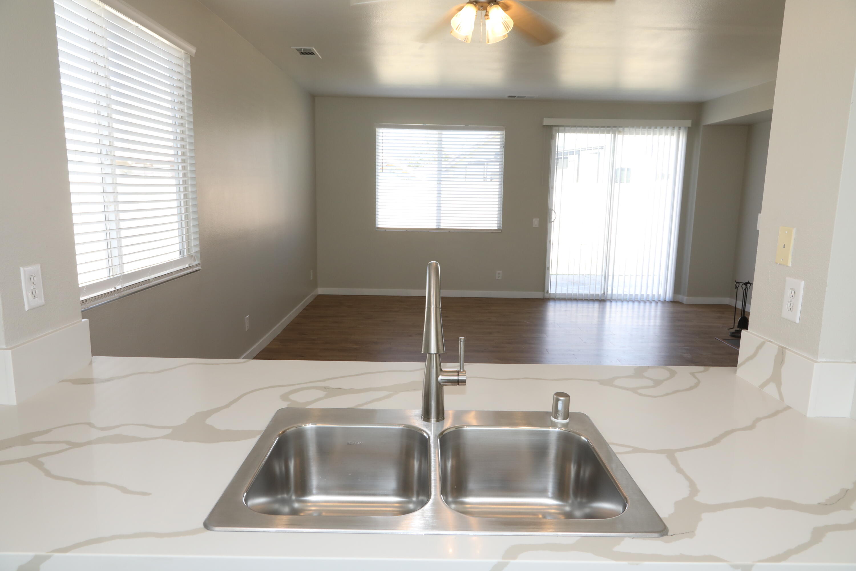 1559 Ave H4 Lancaster, CA 93534 - Photo 3 of 16 a kitchen with a sink and a window