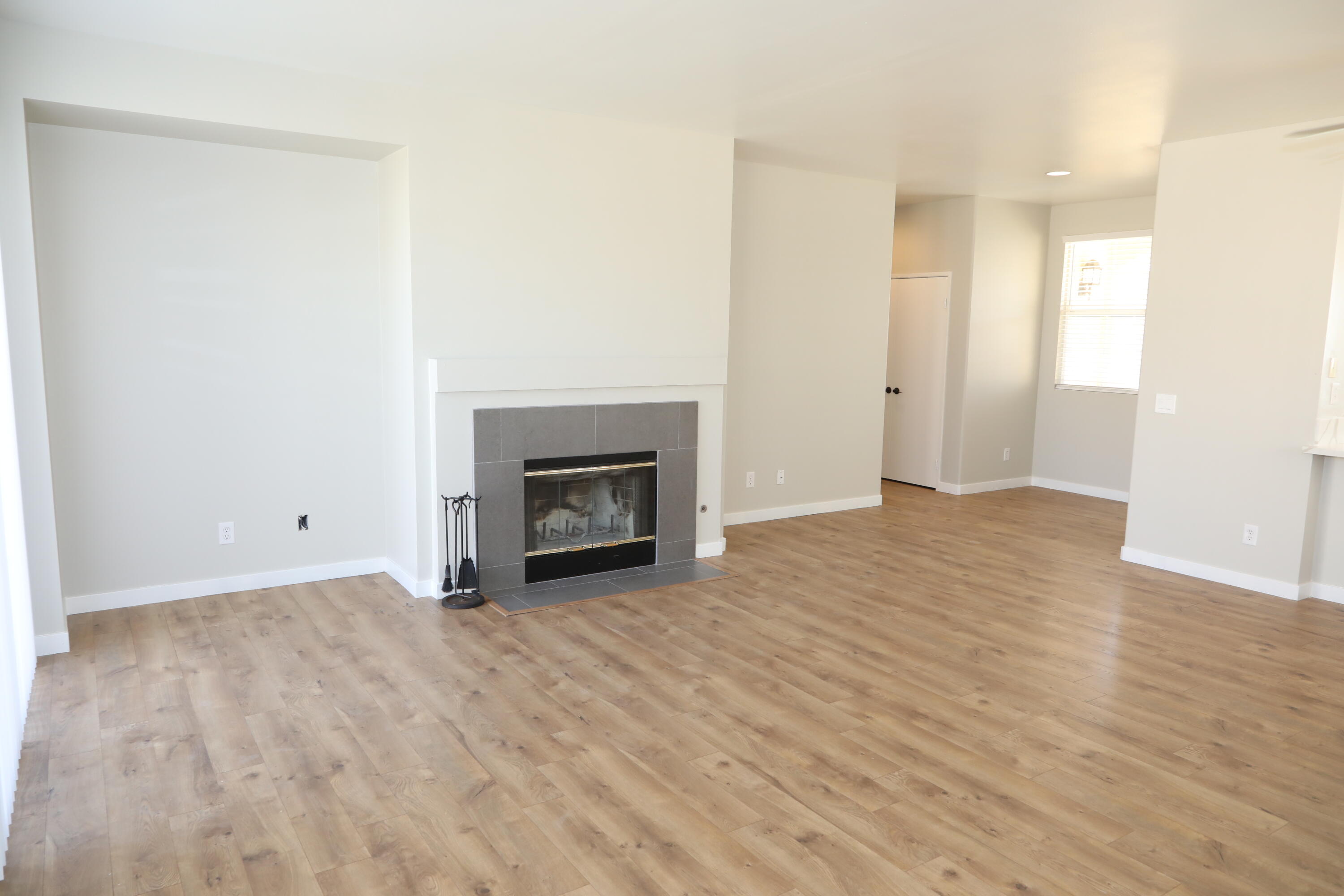 1559 Ave H4 Lancaster, CA 93534 - Photo 6 of 16 a view of empty room with wooden floor
