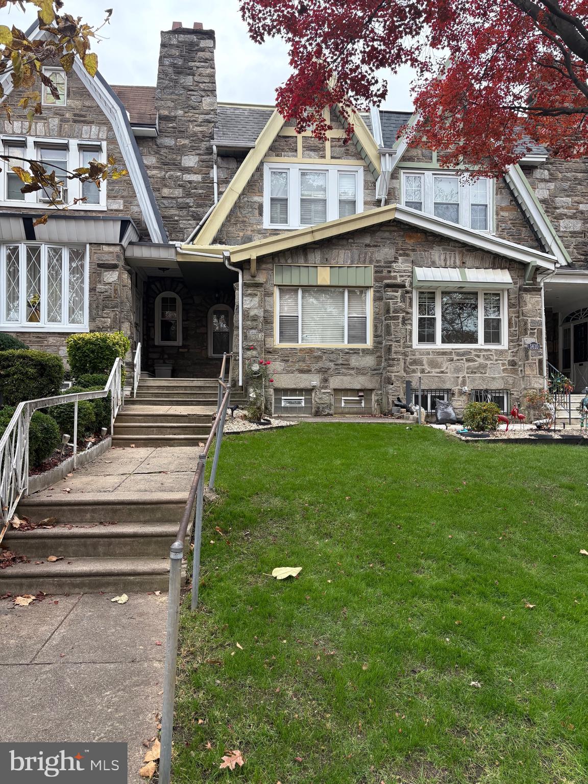 5608 Woodbine Avenue Philadelphia, PA 19131 - Photo 1 of 44 a front view of a house with a yard