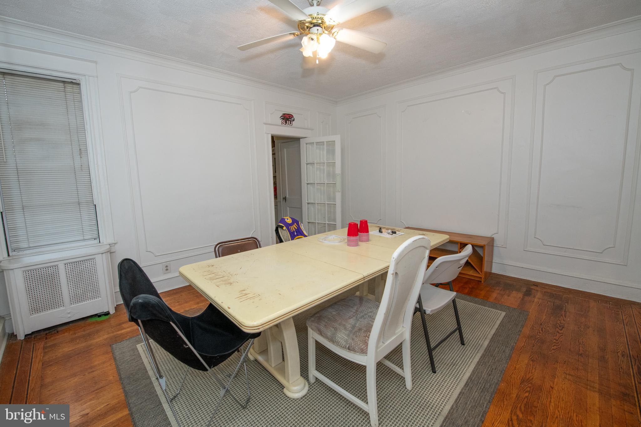 5608 Woodbine Avenue Philadelphia, PA 19131 - Photo 13 of 44 a dining room with a table and chairs