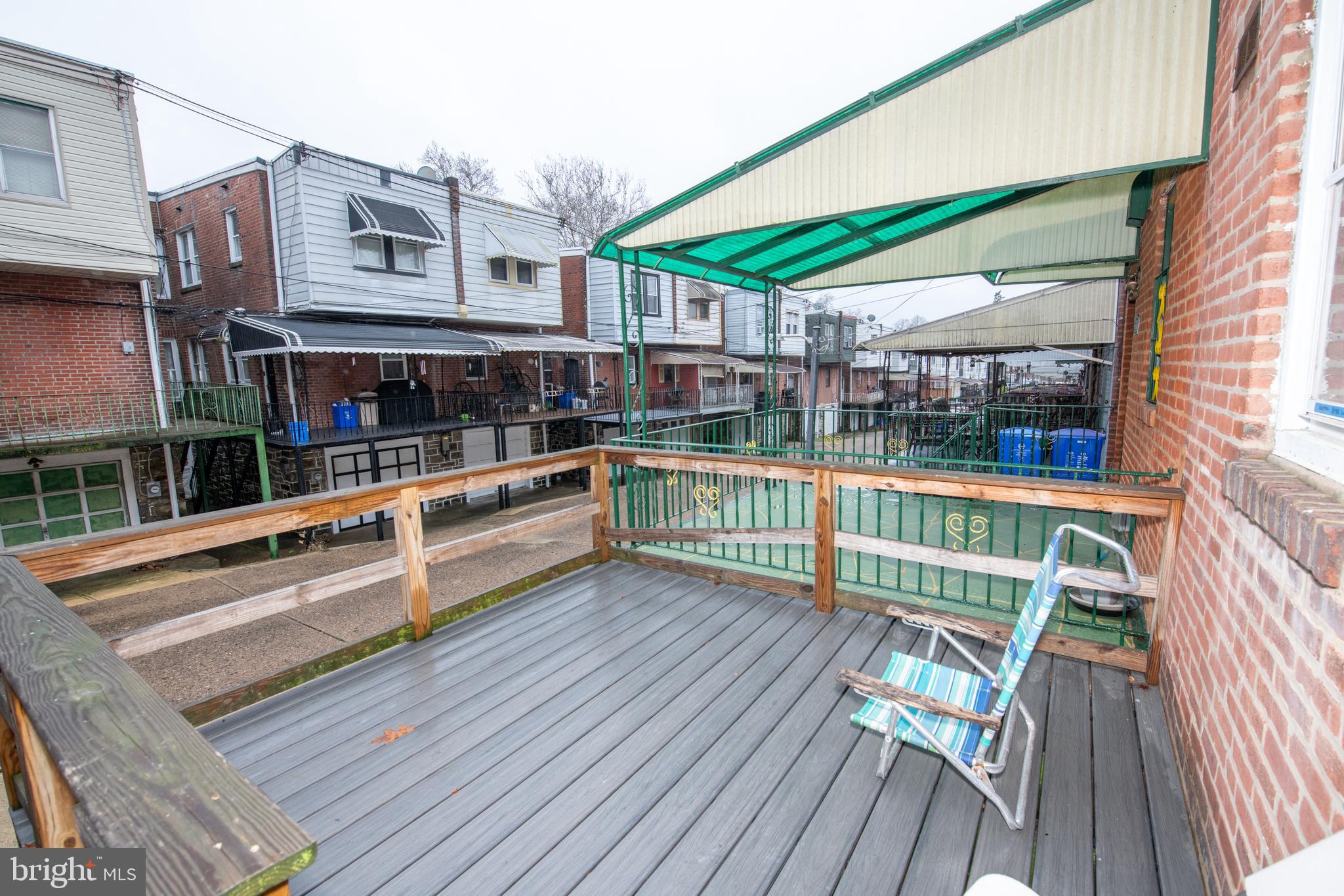 5608 Woodbine Avenue Philadelphia, PA 19131 - Photo 22 of 44 a view of balcony with deck and wooden floor