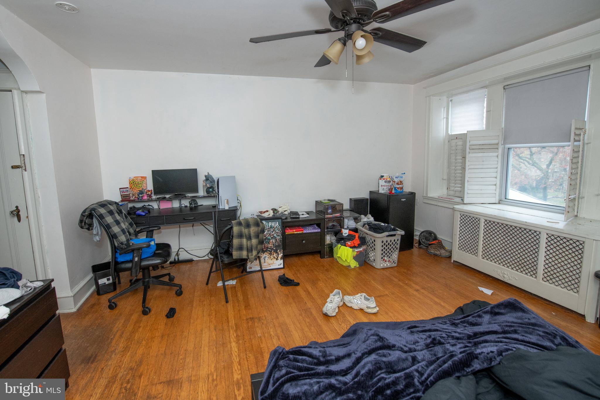 5608 Woodbine Avenue Philadelphia, PA 19131 - Photo 35 of 44 a bed room with a bed and a chair