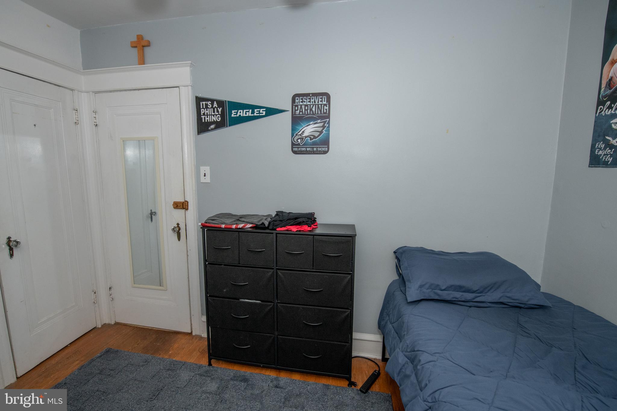 5608 Woodbine Avenue Philadelphia, PA 19131 - Photo 40 of 44 a bedroom with a dresser and a mirror