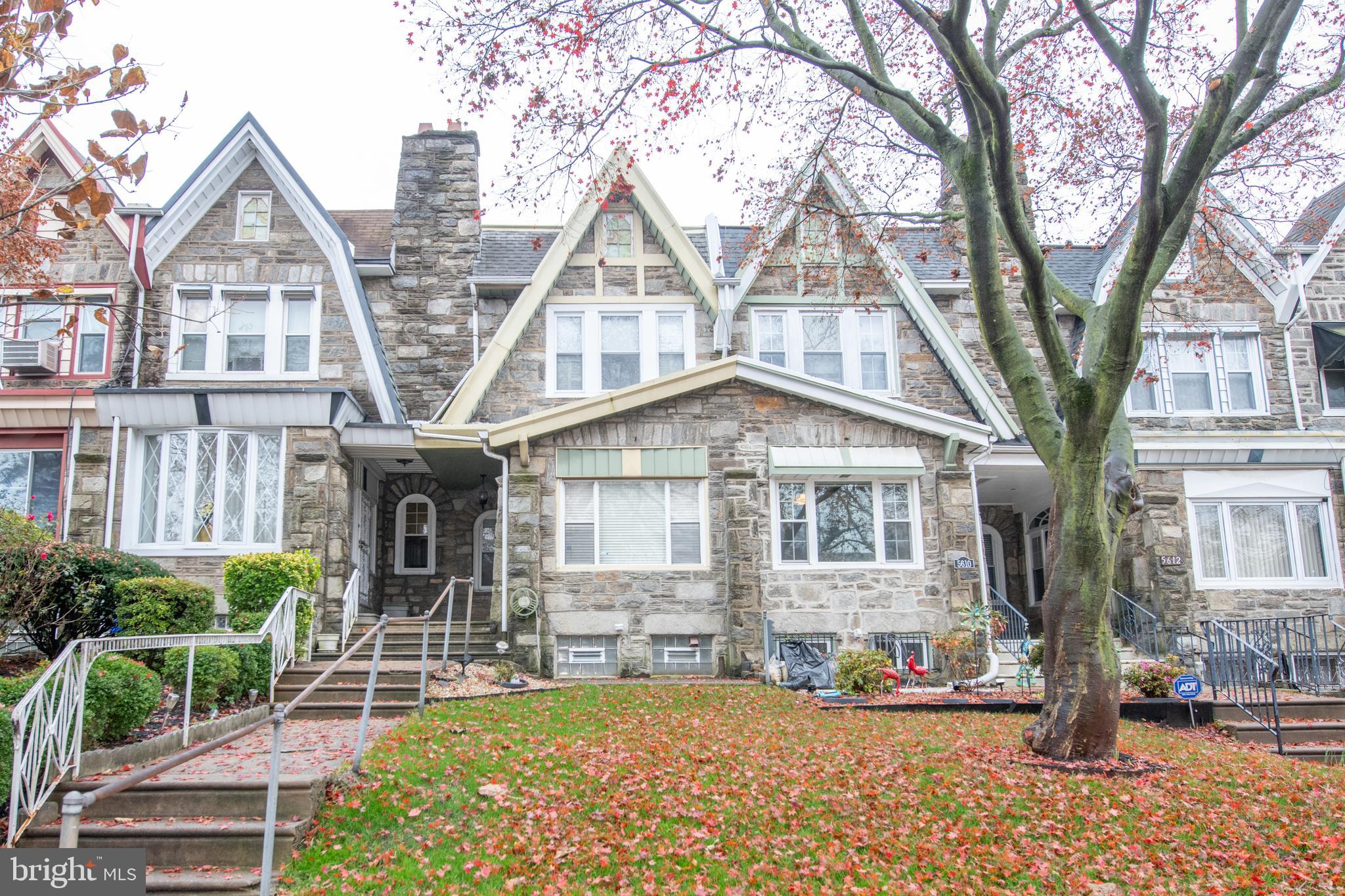 5608 Woodbine Avenue Philadelphia, PA 19131 - Photo 4 of 44 a front view of a house with garden