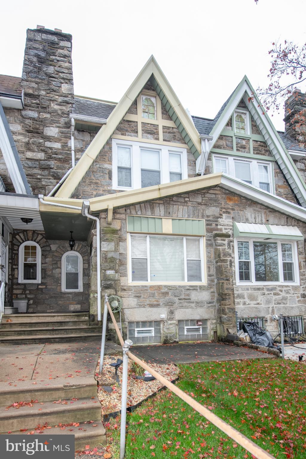 5608 Woodbine Avenue Philadelphia, PA 19131 - Photo 5 of 44 front view of a house with a yard