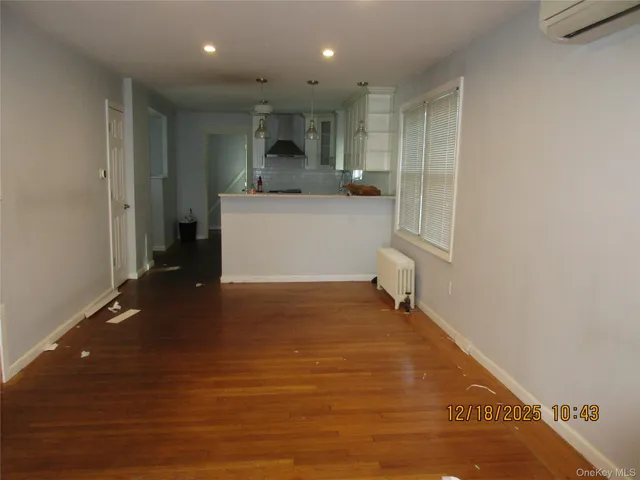 a view of a kitchen with a sink and cabinets