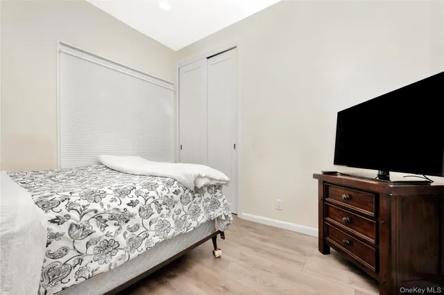 a view of staircase with railing and a painting on the wall