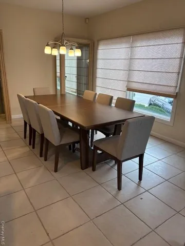 a living room with couches and a flat screen tv