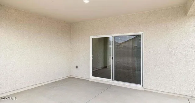 an empty room with glass door