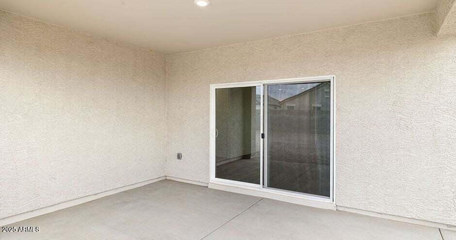 25200 North 151st Drive, Unit 5 Surprise, AZ 85387 - Photo 12 of 14 an empty room with glass door