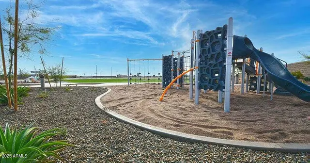 a view of a park with swings