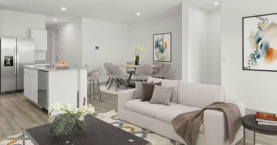 25200 North 151st Drive, Unit 5 Surprise, AZ 85387 - Photo 4 of 14 a living room with furniture and a wooden floor