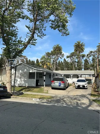 a view of street with parked cars