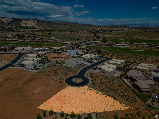 Basalt Cir Street, Unit 1027 St. George, UT 84770 - Photo 23 of 29 Aerial perspective of suburban area featuring a mountainous background