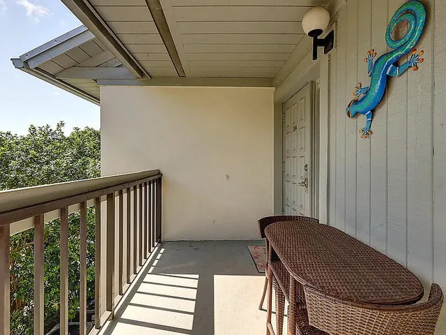 a view of porch with furniture and garden