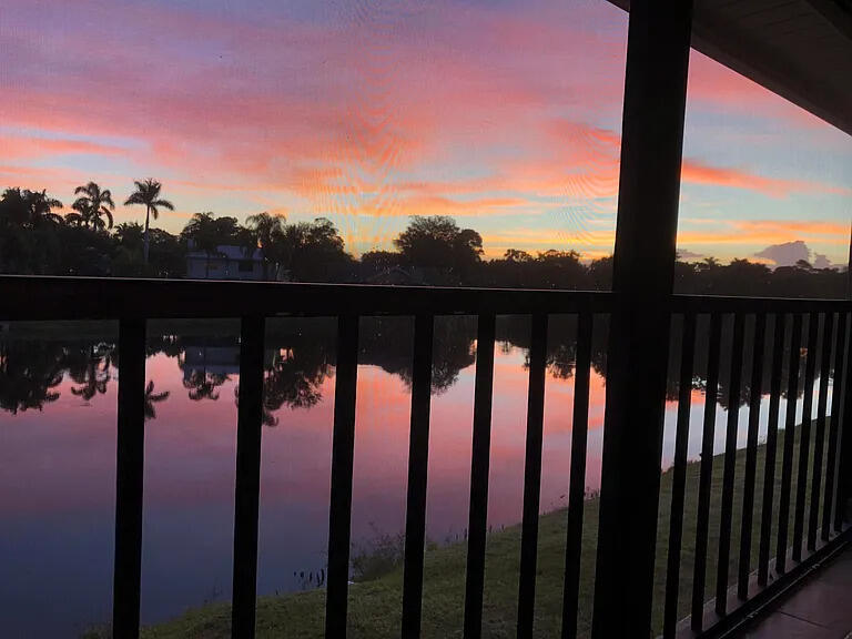 2243 Northwest 22nd Avenue, Unit 104 Stuart, FL 34994 - Photo 22 of 26 a view of swimming pool from a balcony