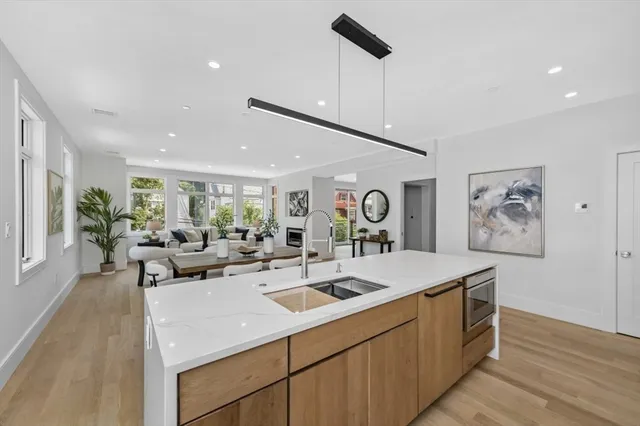 a view of living room with furniture and wooden floor