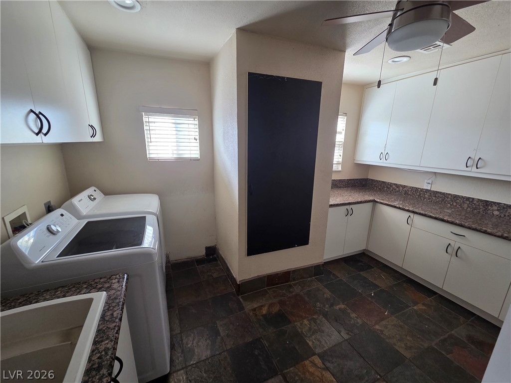 3381 Westwind Road Las Vegas, NV 89146 - Photo 23 of 52 Ample storage and a practical layout create a highly functional laundry space.