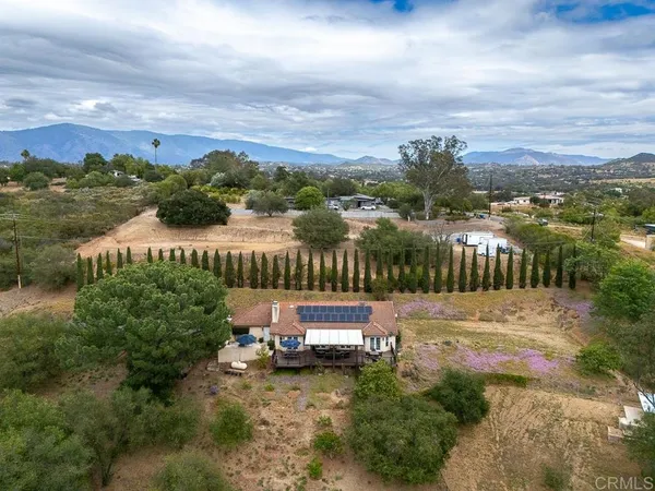 an aerial view of residential house and trees