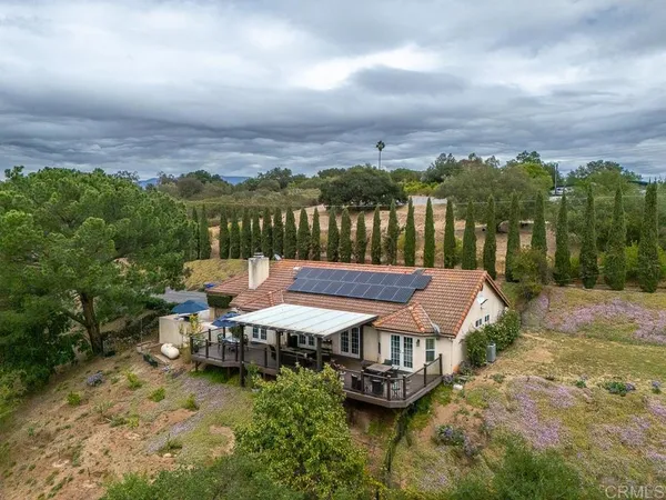 an aerial view of a house with a garden