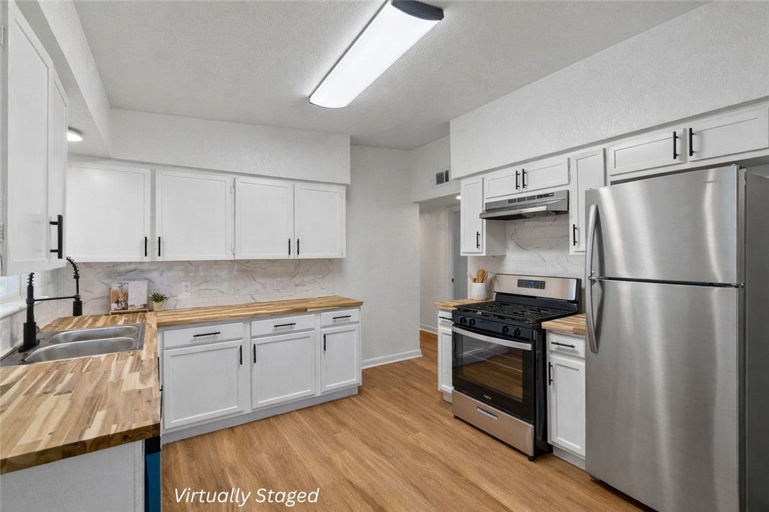 4018 Stirman Street Corpus Christi, TX 78411 - Photo 12 of 22 a kitchen with a sink appliances and cabinets