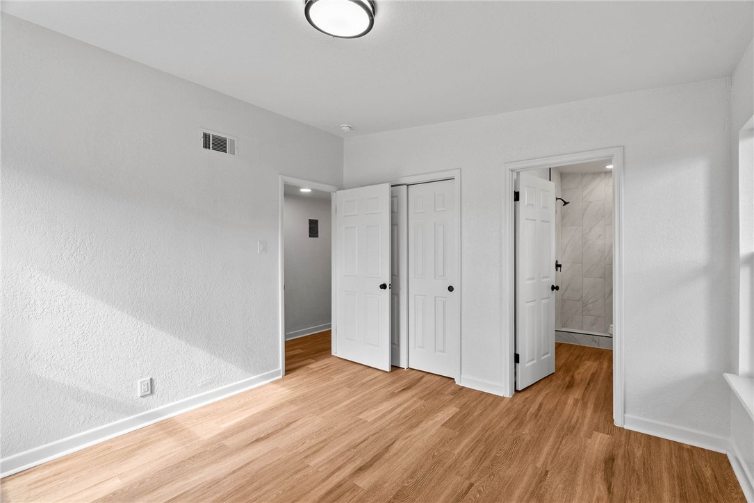 4018 Stirman Street Corpus Christi, TX 78411 - Photo 17 of 22 a view of a room with wooden floor and white doors