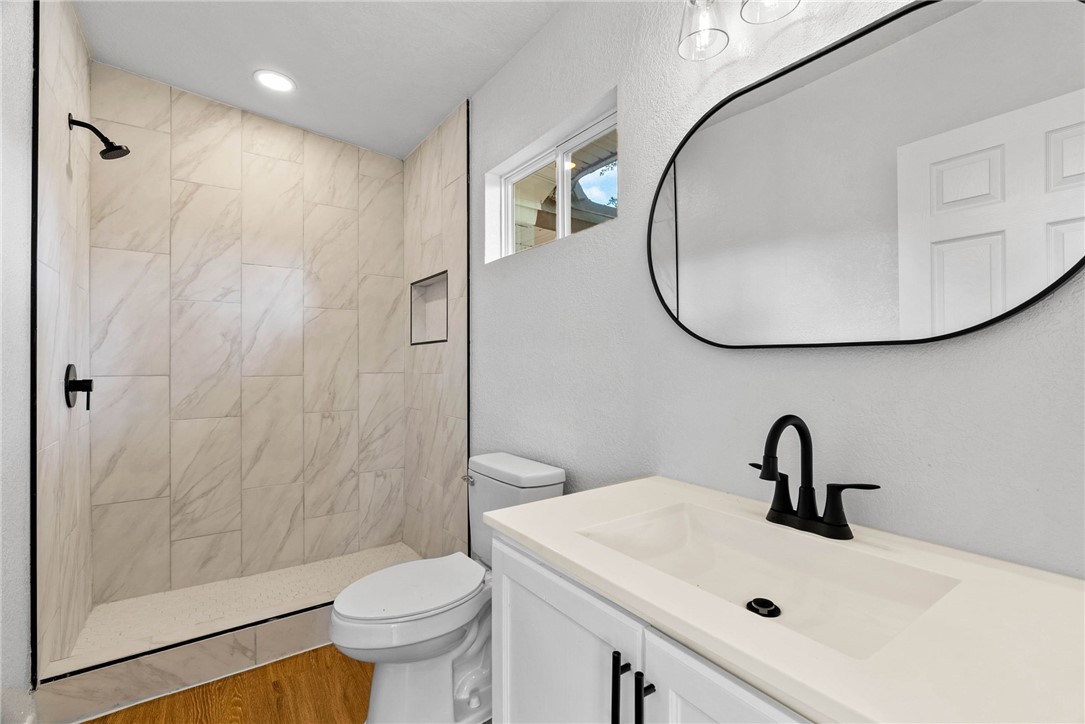 4018 Stirman Street Corpus Christi, TX 78411 - Photo 18 of 22 a bathroom with a sink toilet and a mirror
