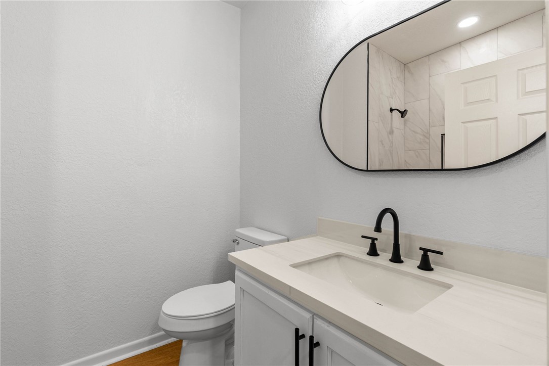 4018 Stirman Street Corpus Christi, TX 78411 - Photo 20 of 22 a bathroom with a sink and a mirror