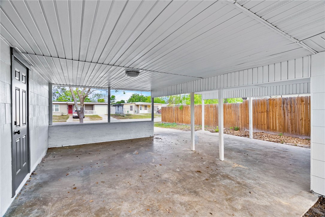 4018 Stirman Street Corpus Christi, TX 78411 - Photo 4 of 22 an empty room with large windows and city view