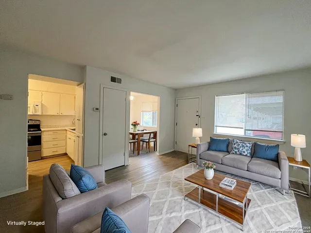 a living room with furniture and a window